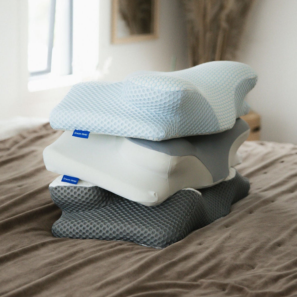 Bundle of Dream Sleep orthopaedic memory foam posture pillows and cooling pillowcases for improved sleep posture and neck pain relief.
