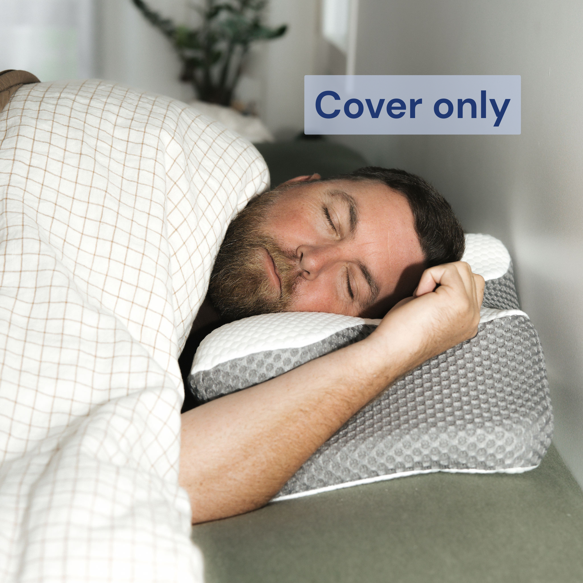 Man sleeping peacefully on a Dream Sleep NZ ergonomic memory foam orthopaedic pillow using a grey textured breathable replacement cover.