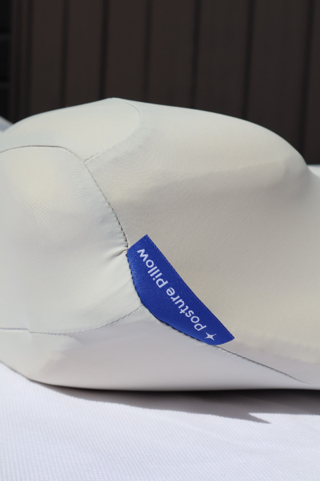 Detail of the Cool-touch fabric texture and the Dream Sleep "Posture Pillow" tag, emphasizing the quality and breathable material.