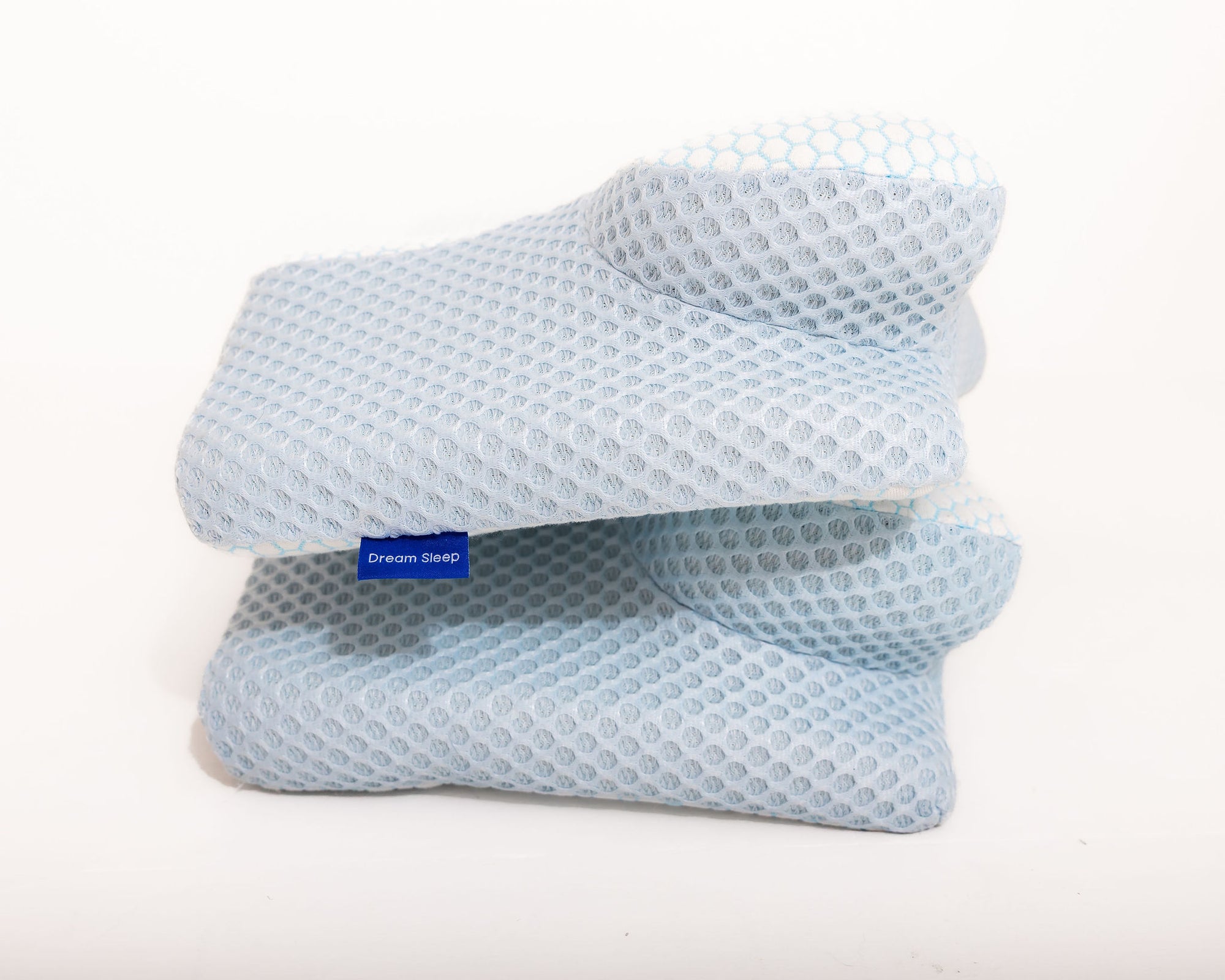 Detailed view of the Dream Sleep Alpine Blue cervical alignment memory foam pillow. This specialised orthopaedic sleep aid offers firm, customised posture correction and therapeutic comfort for those managing neck tension.