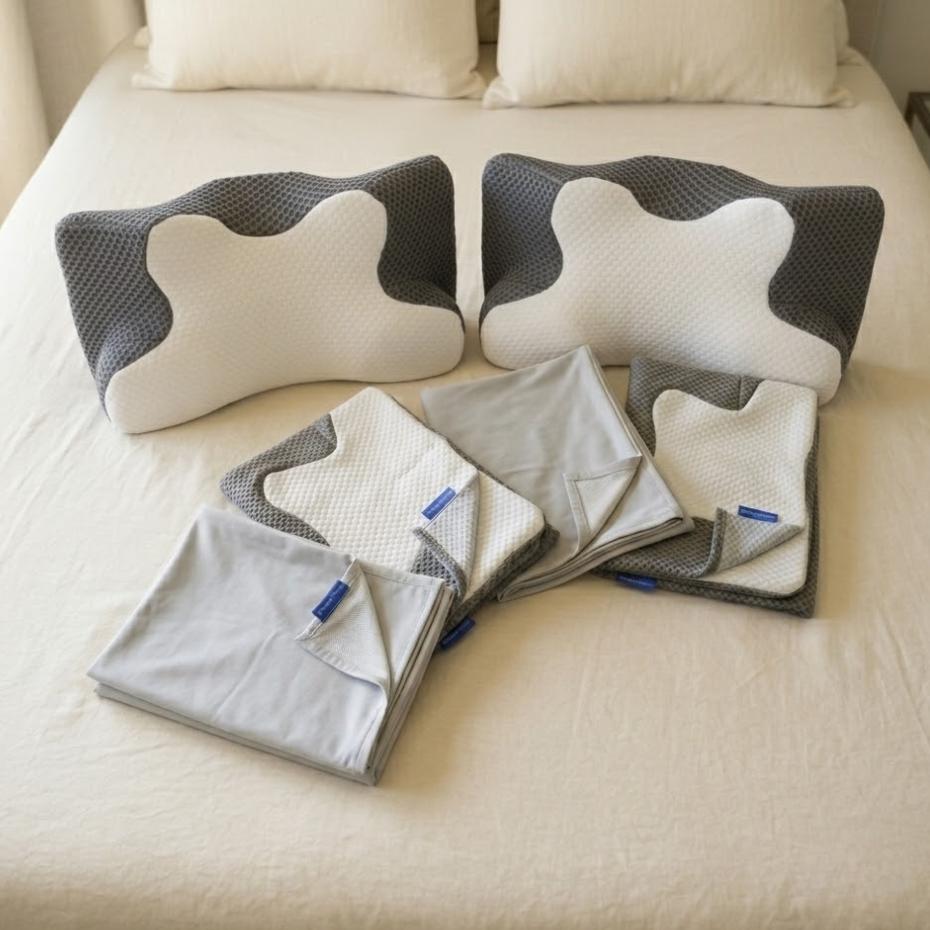 Dream Sleep Bundle including two ergonomic contour memory foam pillows and four cooling covers for neck pain relief.