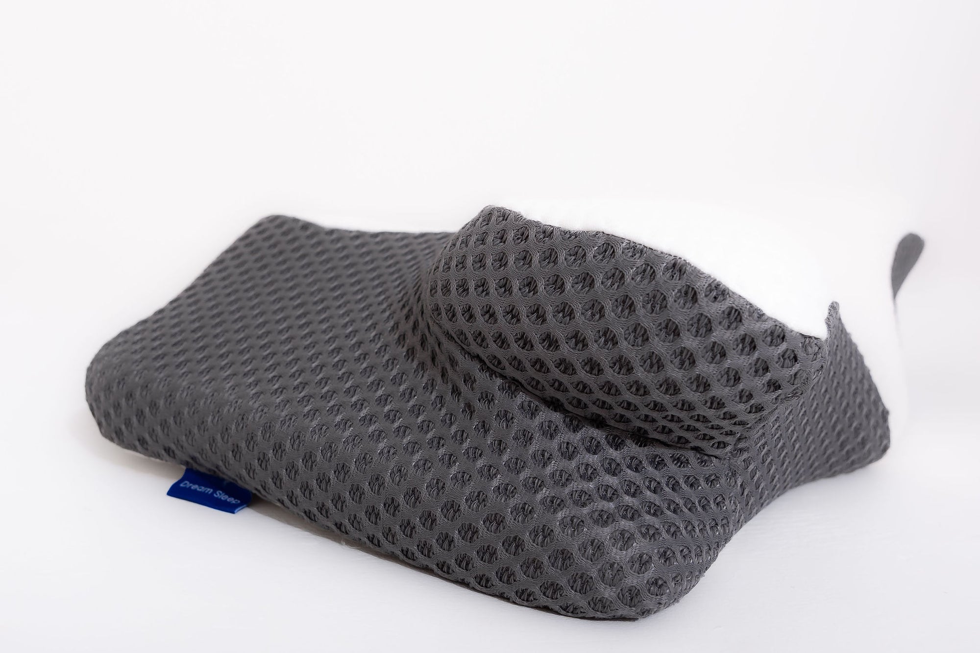 Stack of neatly folded Dream Sleep replacement pillowcases in Grey/White, available as a high-quality, essential accessory.