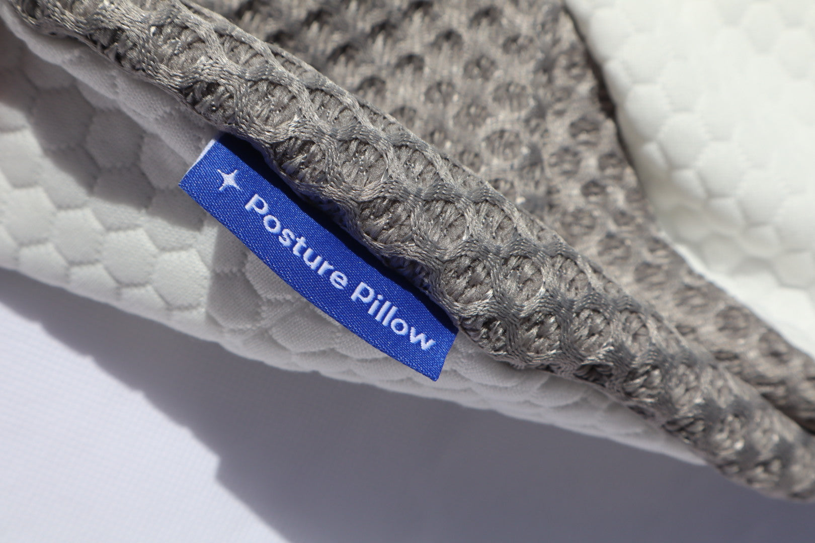 Detail shot of the soft, durable, and breathable fabric texture of the Grey/White Dream Sleep Pillowcase for comfortable sleep.