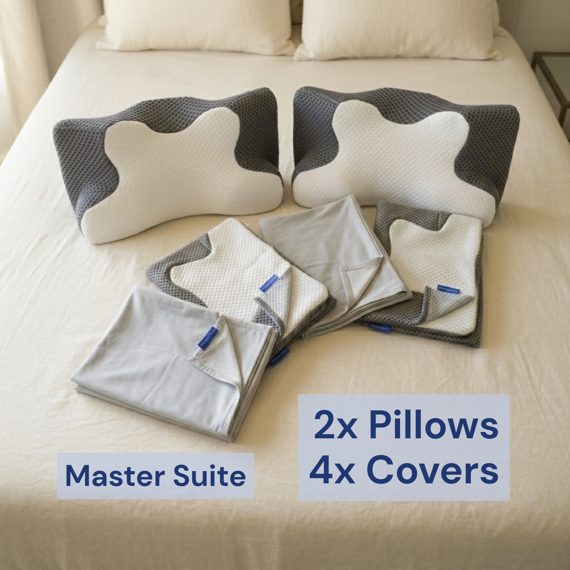 Complete master suite bundle featuring two contour memory foam pillows and four breathable replacement covers on a bed for a full orthopaedic sleep upgrade.