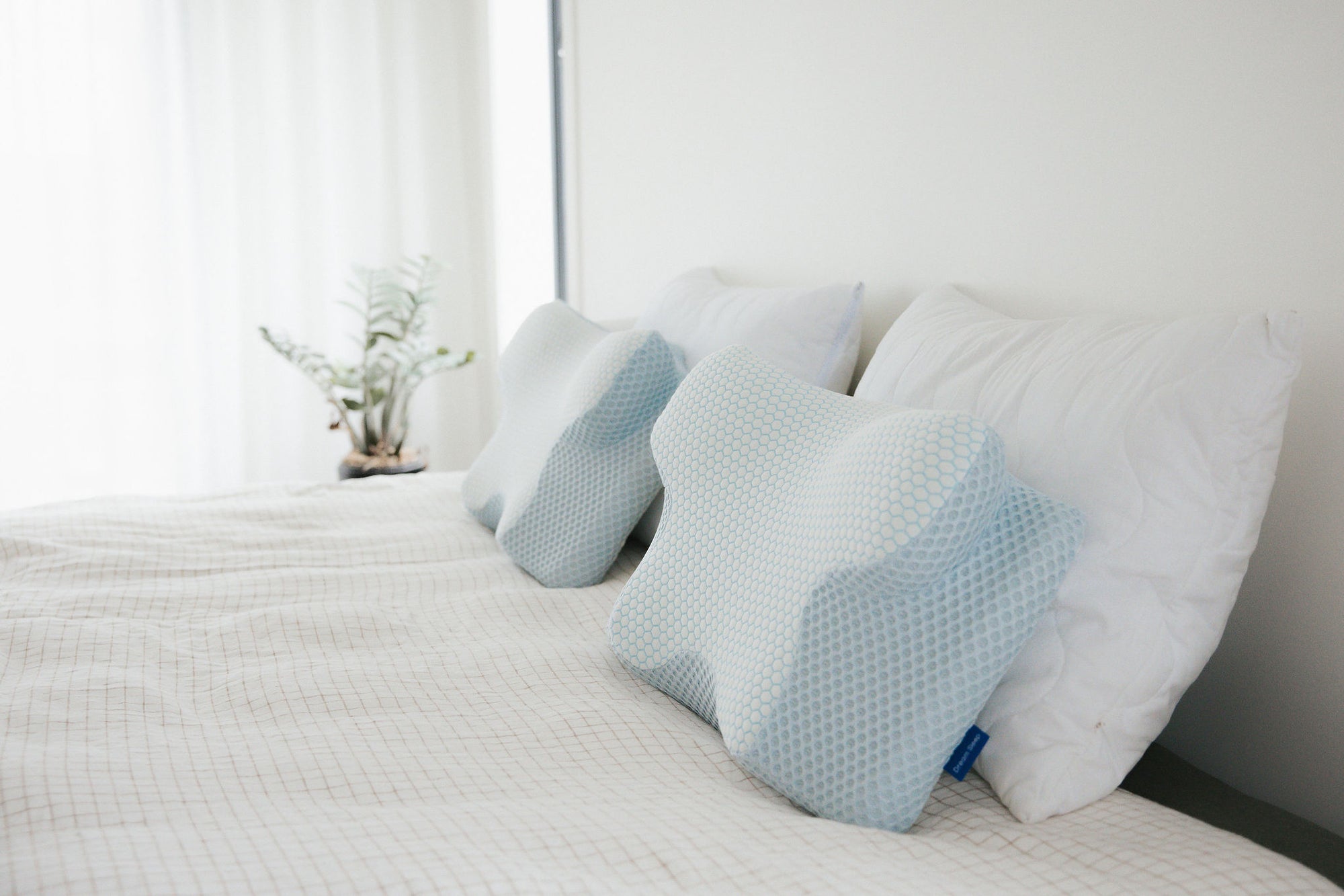 Premium orthopaedic neck pillow by Dream Sleep NZ, scientifically designed to relieve chronic neck pain and improve spinal alignment during sleep.