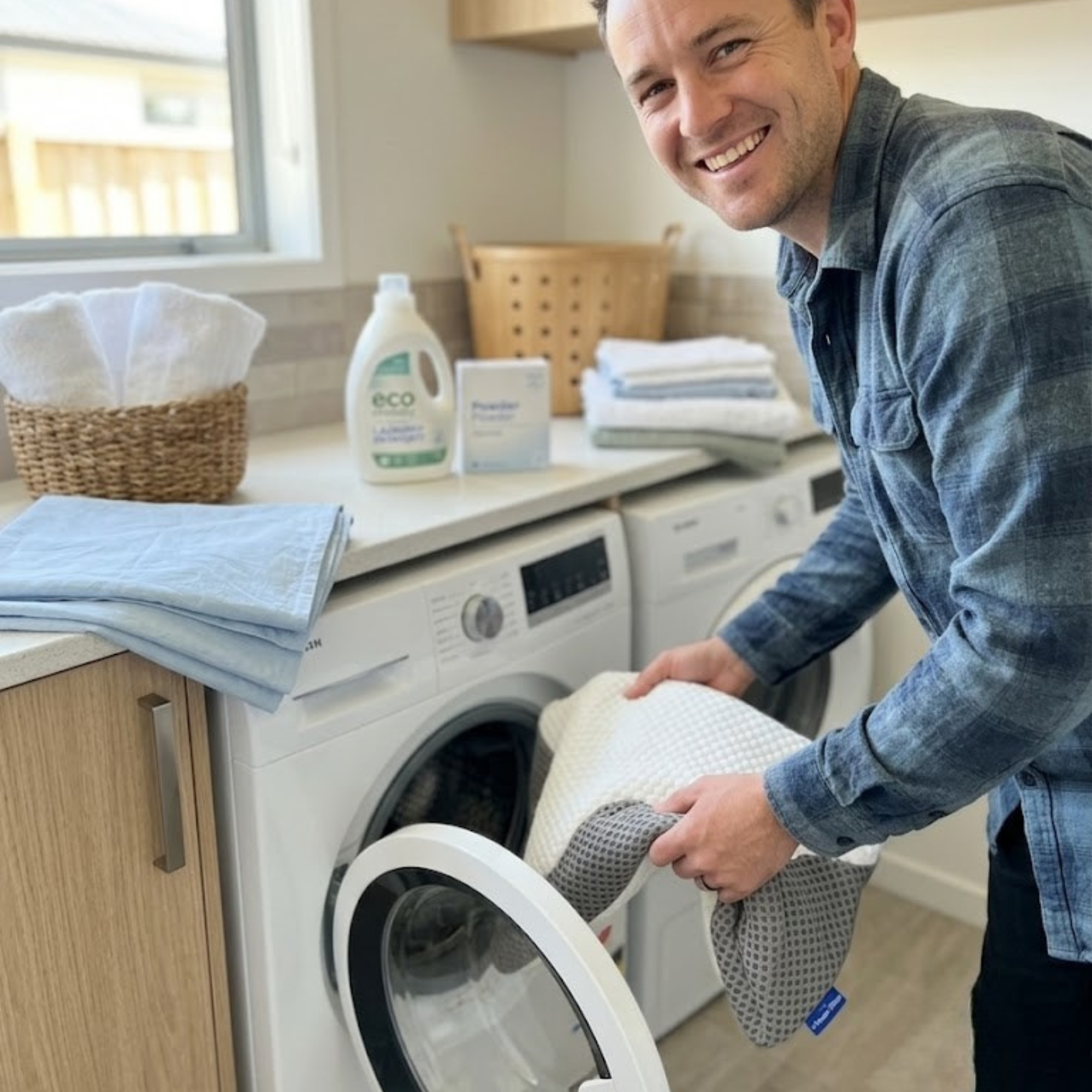 Person washing replacement contour memory foam pillow covers, highlighting the ease of laundry for a clean sleep setup in New Zealand.